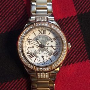 Gently used gold tone Guess watch. Works perfectly